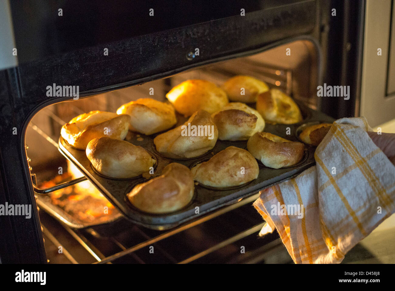 Yorkshire puddings coming out of oven Stock Photo Alamy
