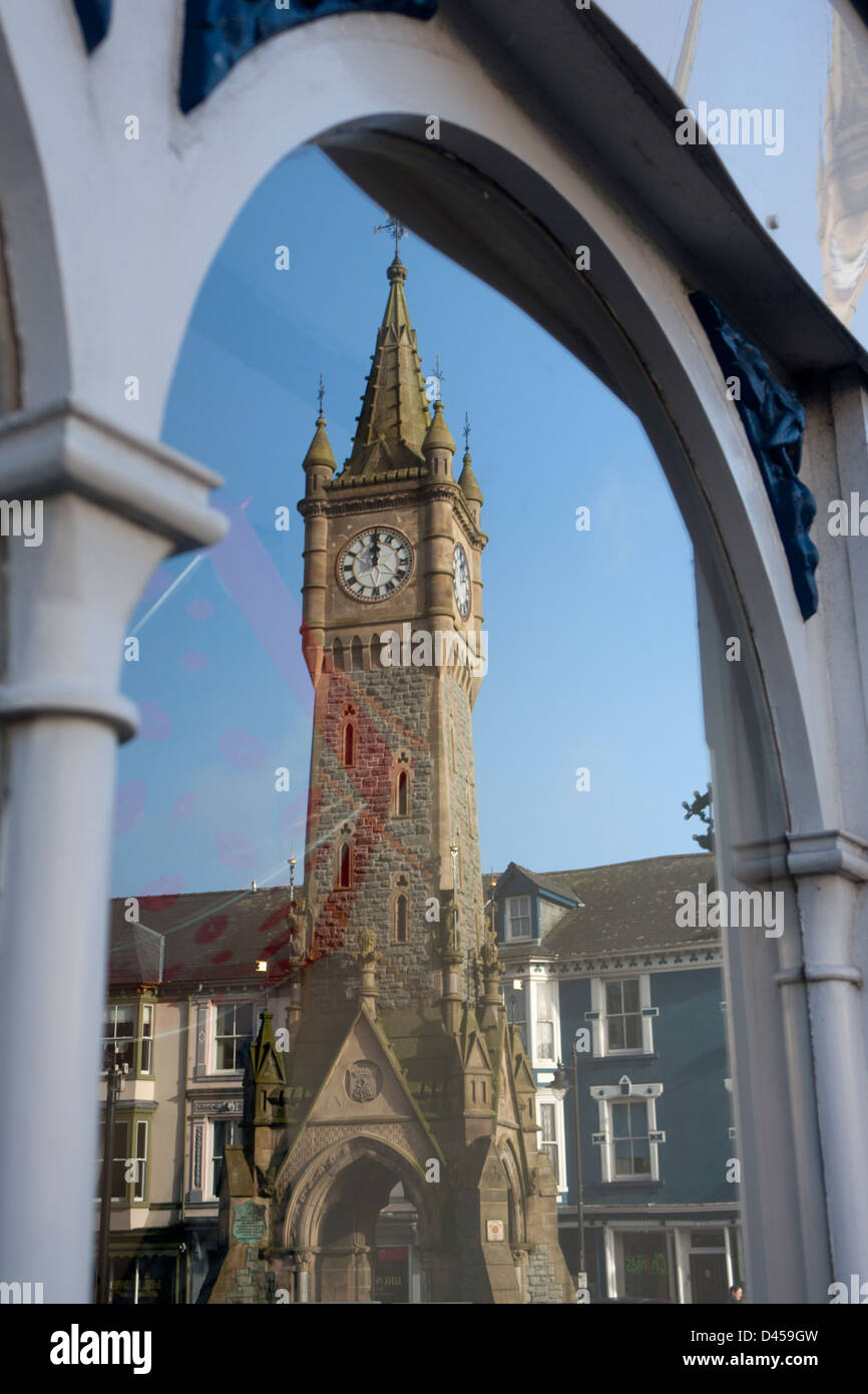 Machynlleth Clock Tower reflected in window of shop Machynlleth Powys Mid Wales UK Stock Photo