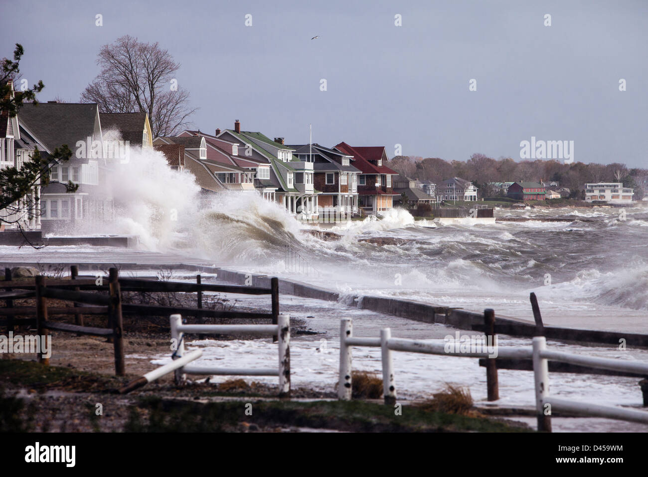 Summer houses in Madison Connecticut being hit by waves by an extremely high tide, from Hurricane Sandy. Stock Photo