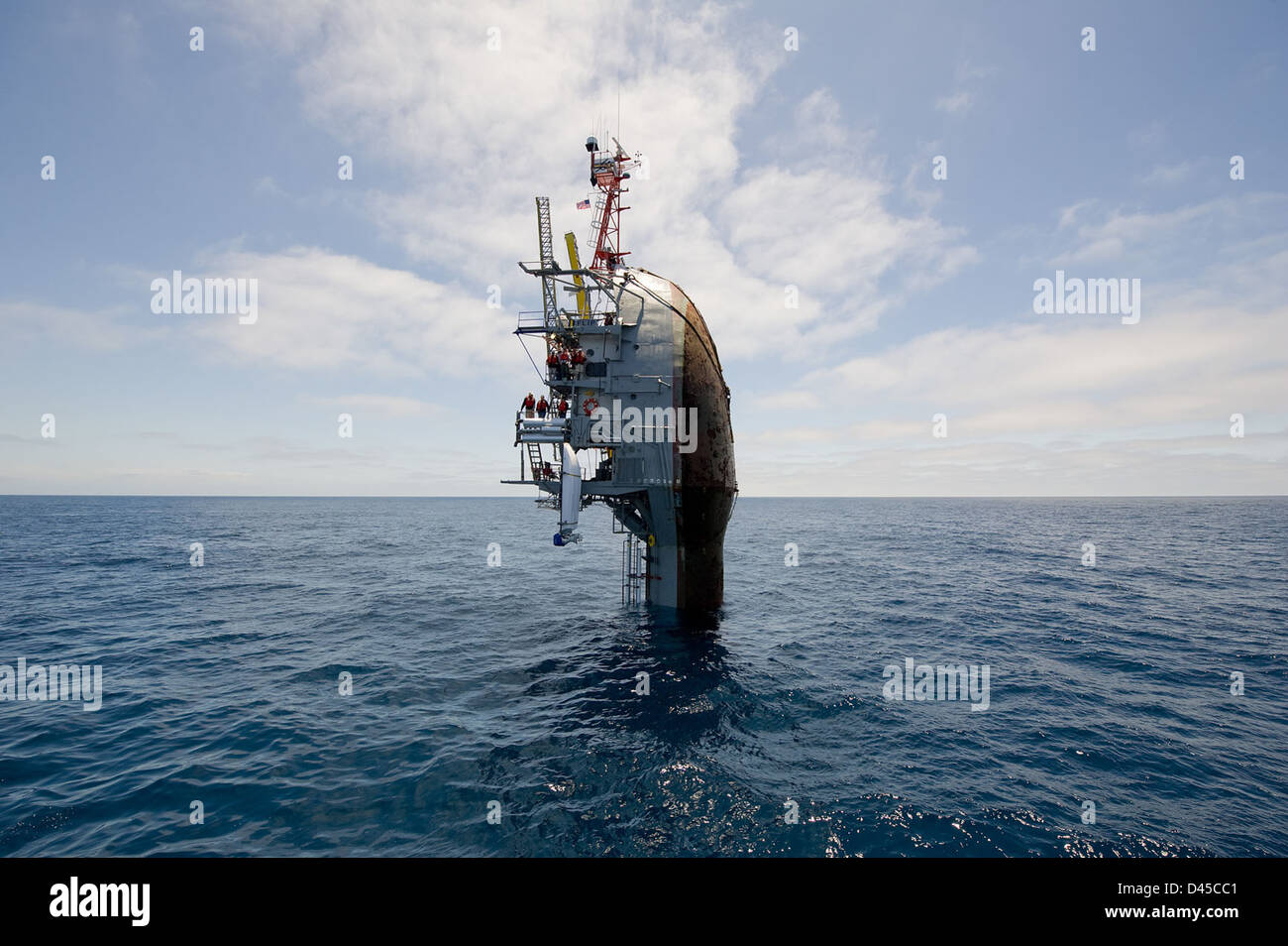 55 feet remain visible after the crew of the Floating Instrument Platform, or FLIP, partially flood the ballast tanks causing the vessel to turn stern first into the ocean. Stock Photo