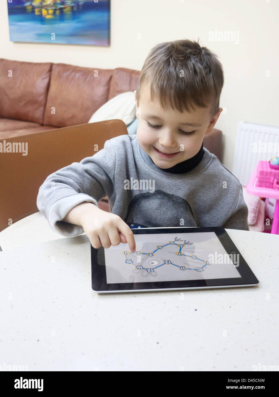 Small boy using an Apple iPad Stock Photo