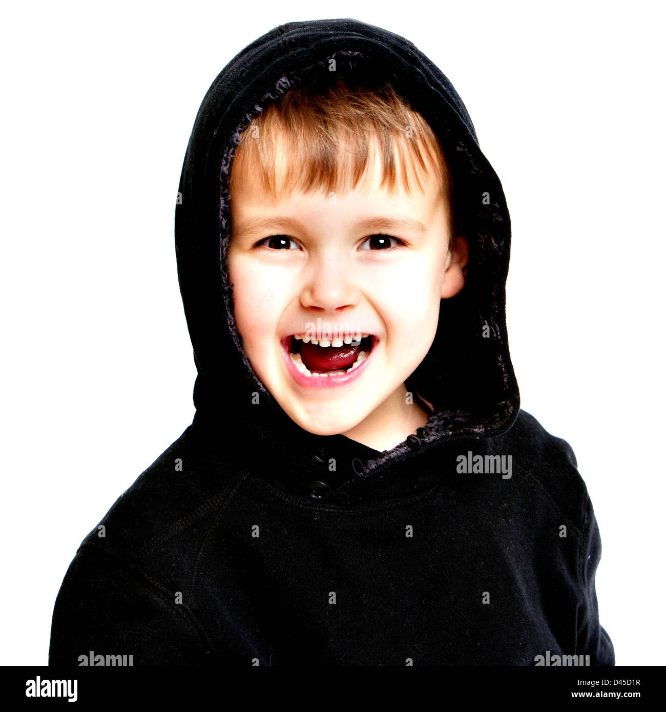 Five year old boy in a black hoodie sweatshirt with sallow skin brown hair and brown eyes against a white background. Stock Photo