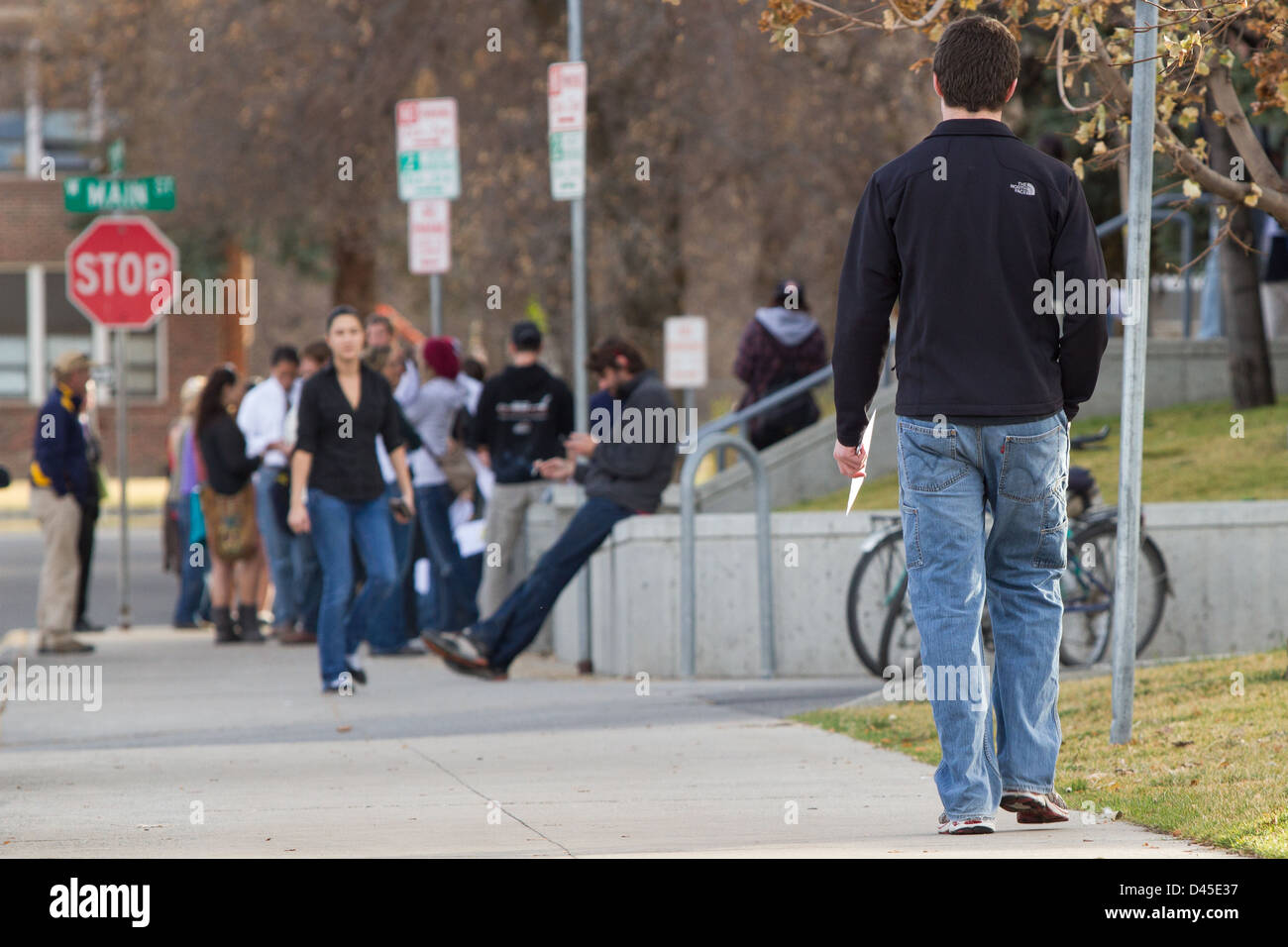 Voters wait outside the the Gallatin County courthouse in Downtown Bozeman Montana to cast their votes. Stock Photo