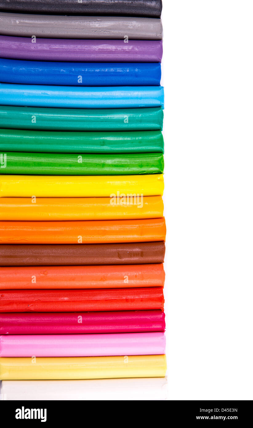 Rainbow colors plasticine bars, modeling clay isolated over white with copyspace for your sample