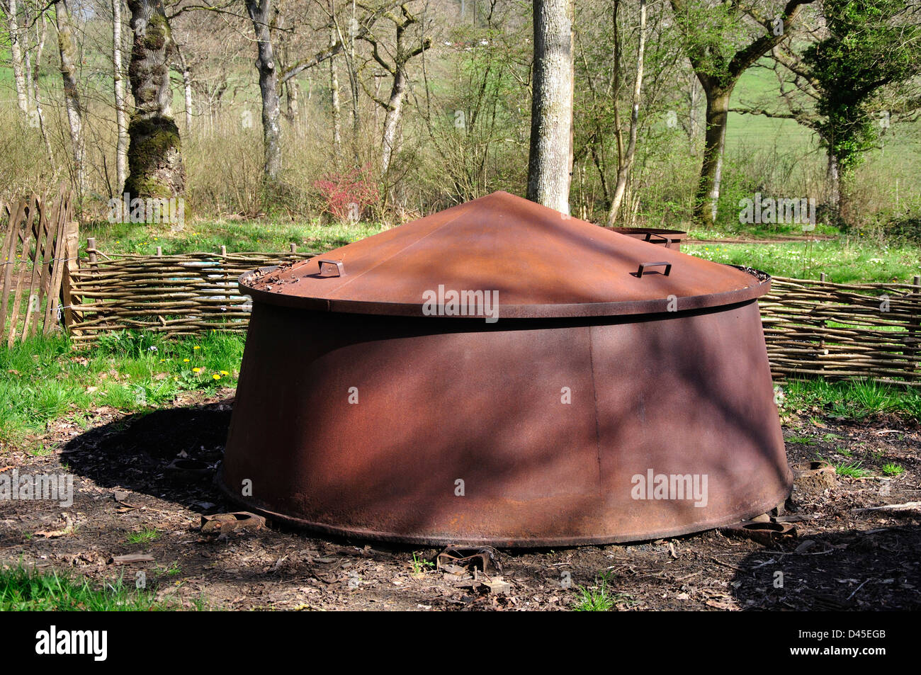 A charcoal burner in a woodland Stock Photo Alamy