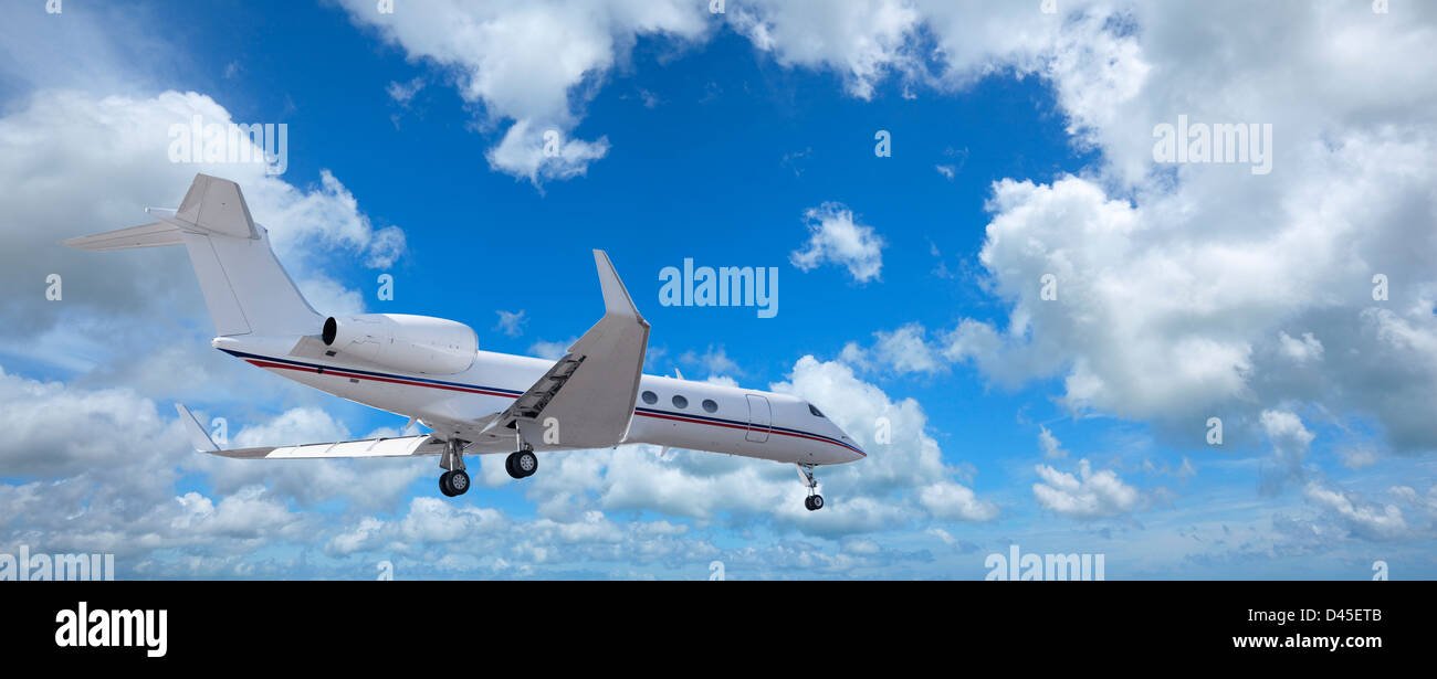 Private jet in a sky Stock Photo
