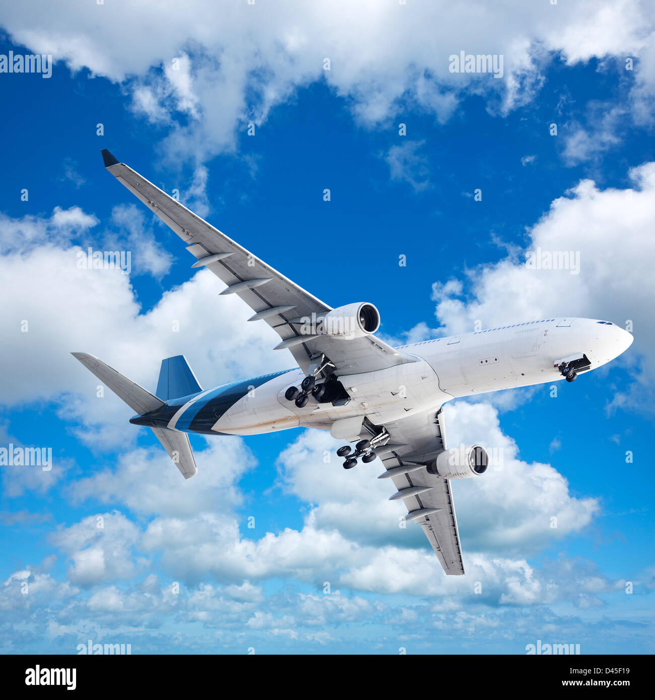Jet meneuvering in a blue cloudy sky. Square composition. Stock Photo