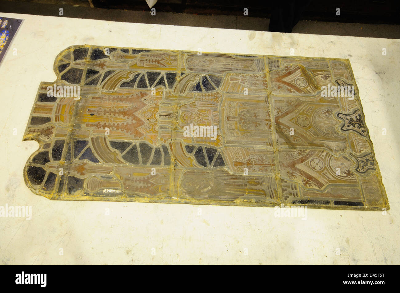 An old stained glass window in the process of being repaired Stock