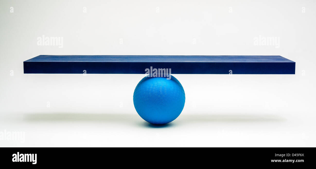 Blue boarfd balanced on ball Stock Photo - Alamy