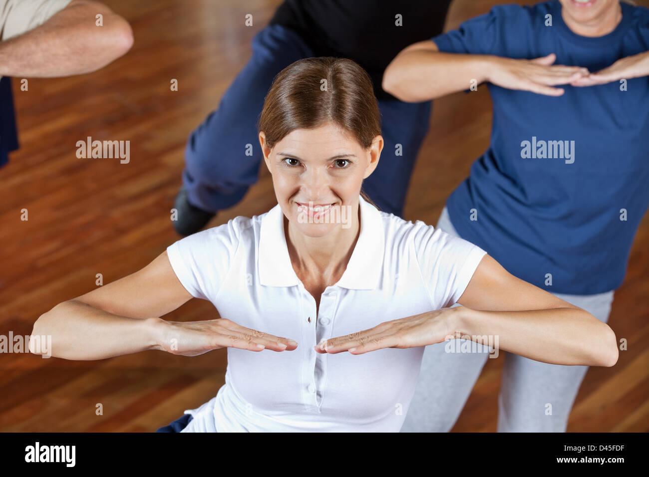 Active senior people dancing and working out in gym Stock Photo