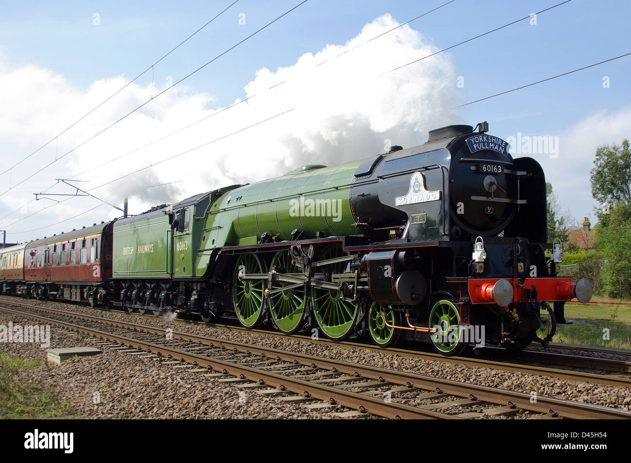 60163 Tornado mainline steam locomotive train, newly built in England. Completed in 2008 it often runs on UK mainline rails. Hauling special Stock Photo