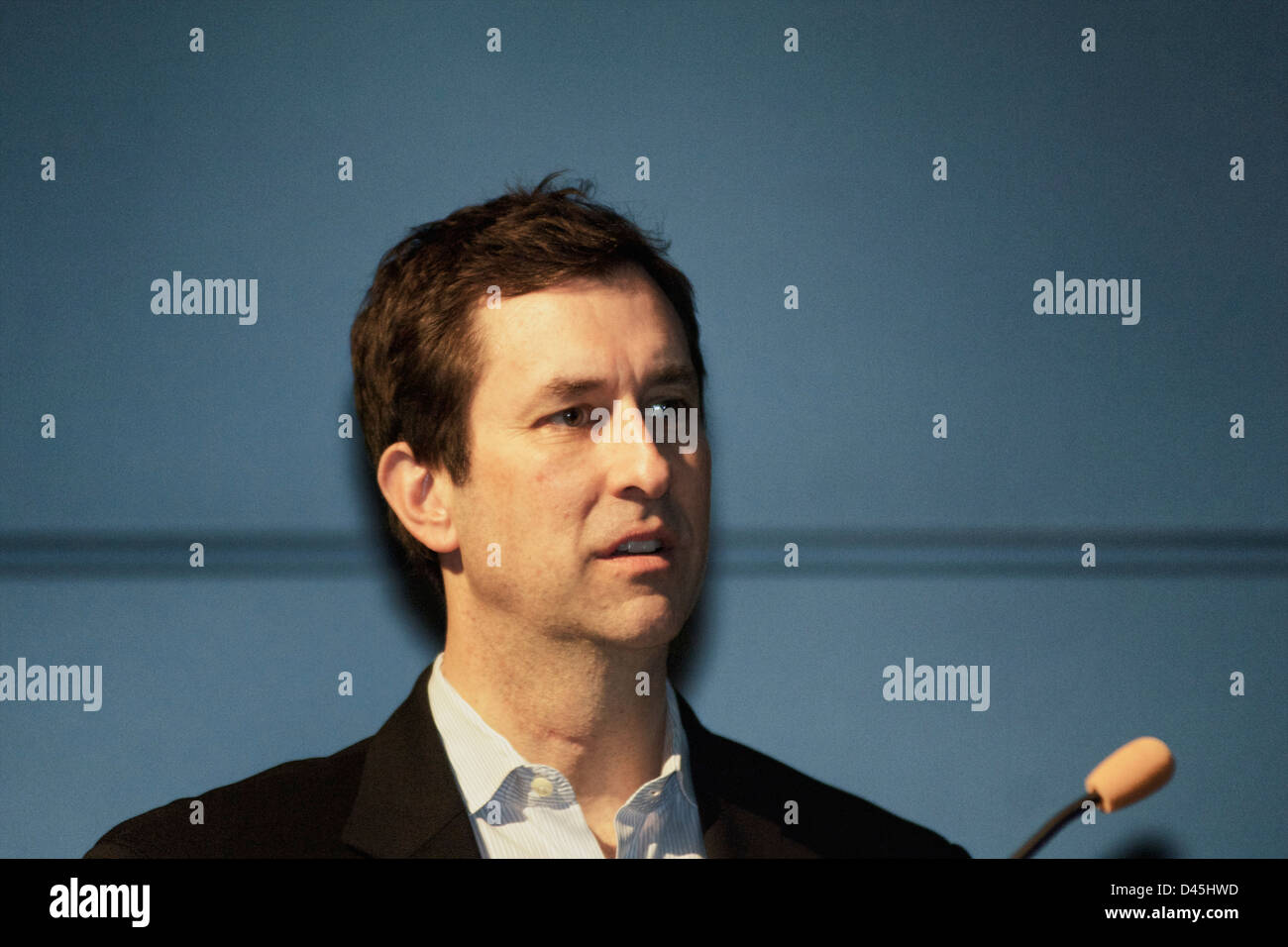 Joe Battenfeld intently listening to comments from panel at Town Hall
