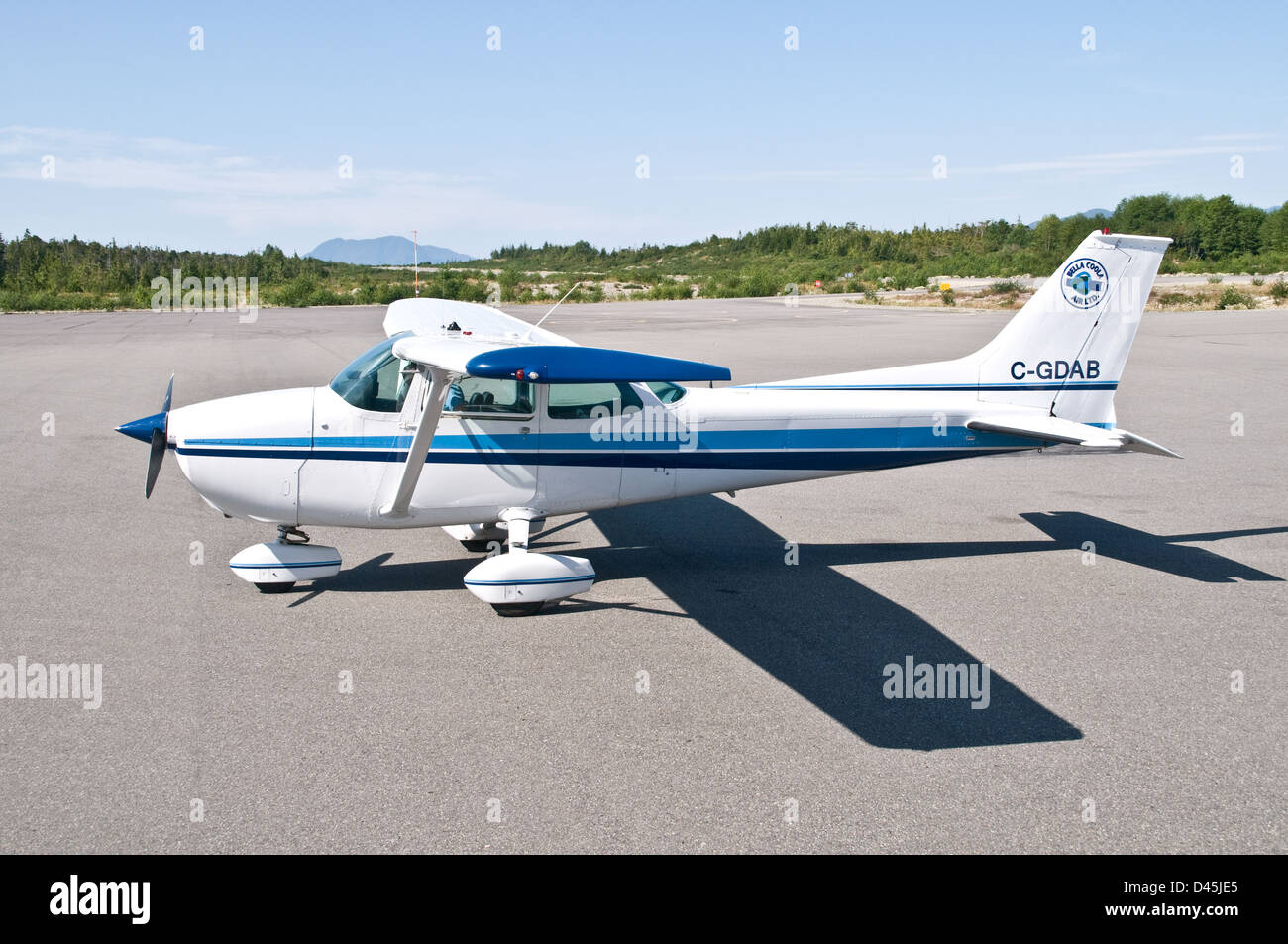 A Cessna 172 airplane parked on the tarmac at Bella Bella airport, in the Great Bear Rainforest, British Columbia, Canada. Stock Photo