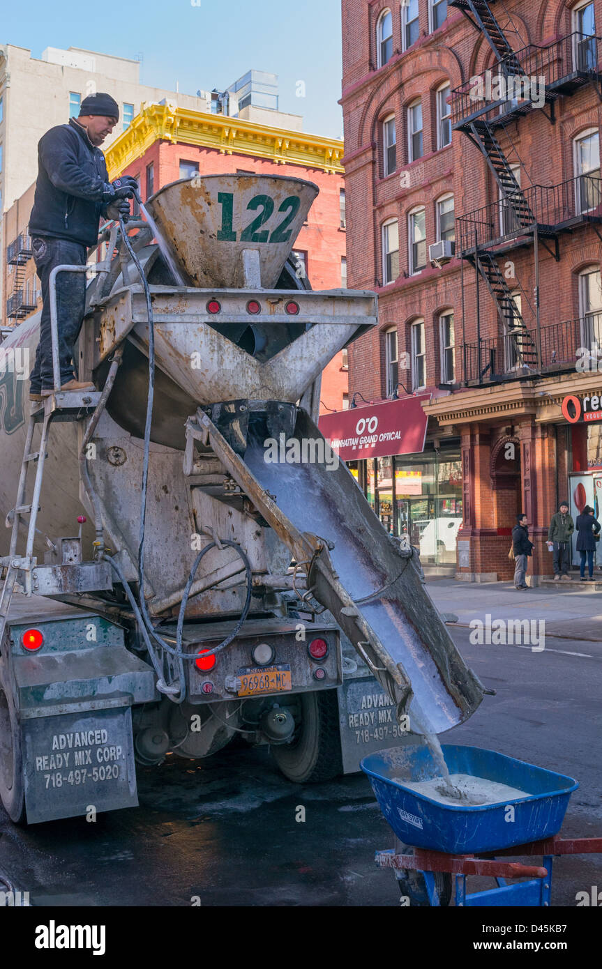 Construction worker mixing concrete in New York City on DDC project