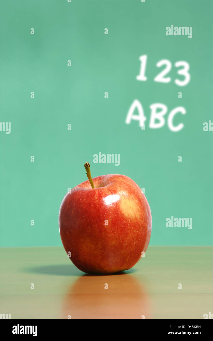 An apple on a desk in a classroom Stock Photo Alamy