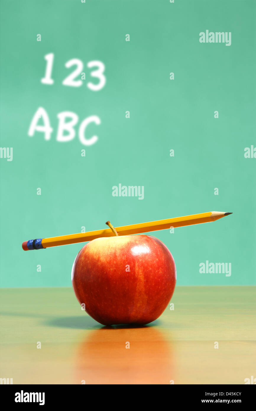 An apple on a desk in a classroom Stock Photo Alamy