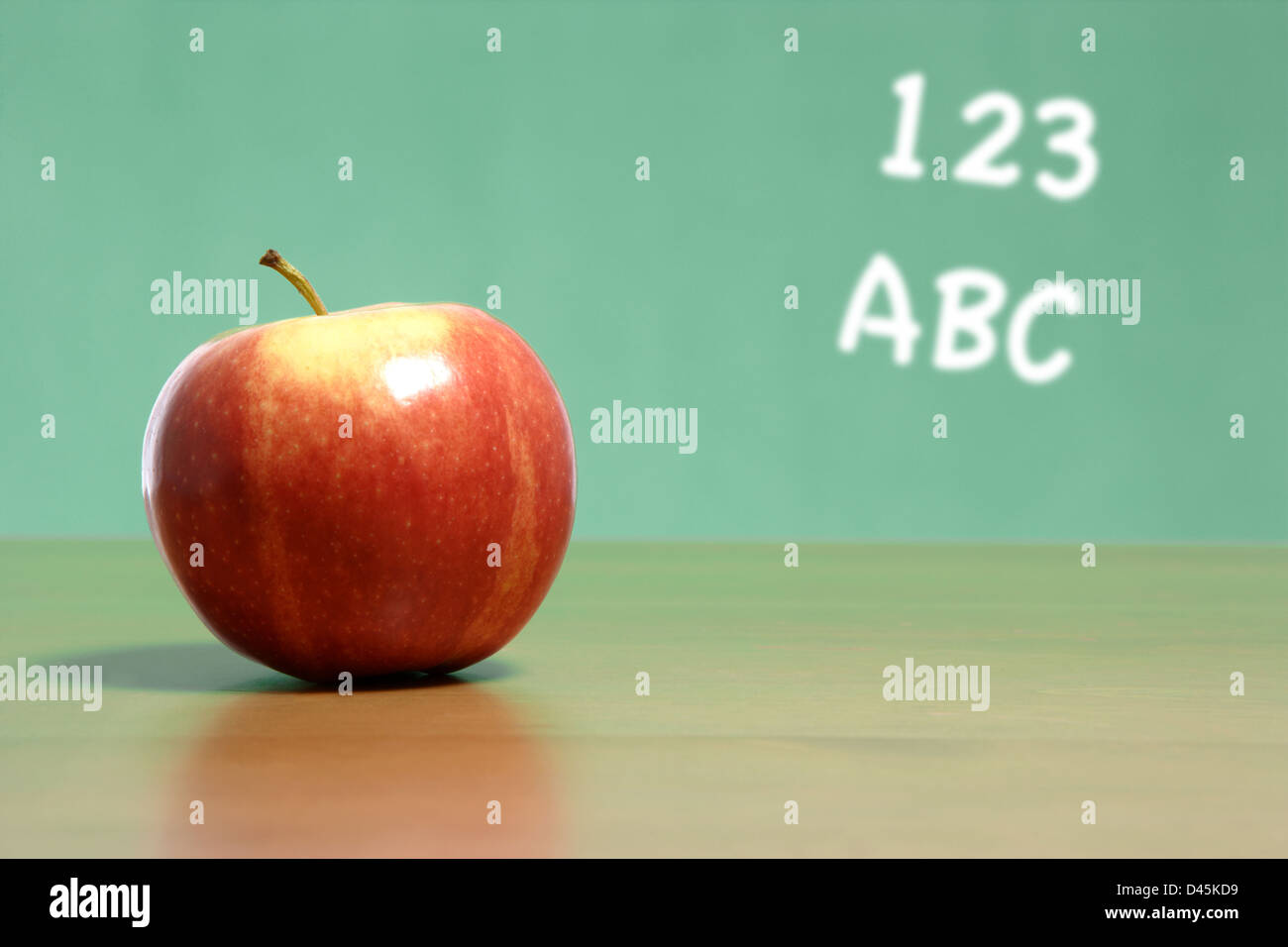 An apple on a desk in a classroom Stock Photo Alamy
