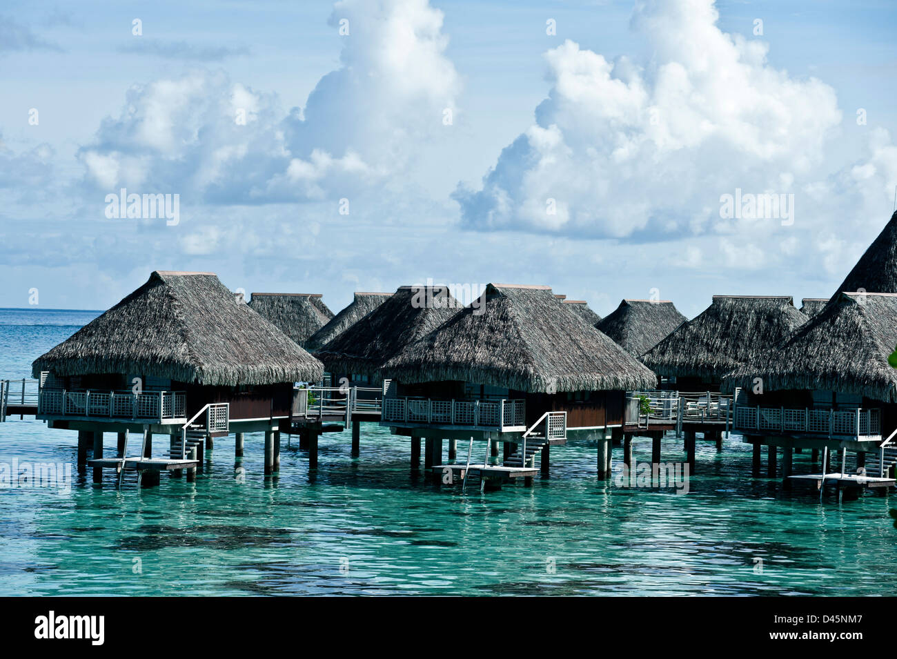 Over-water thatch bungalos, French Polynesia Stock Photo
