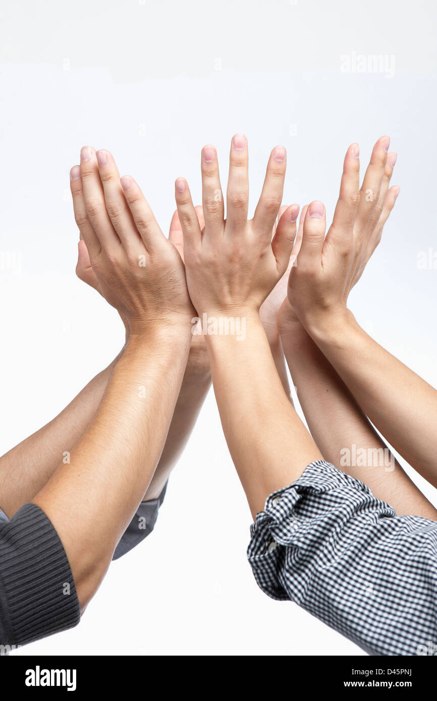 businessmen's hands gethered up together in the air as if holding something Stock Photo