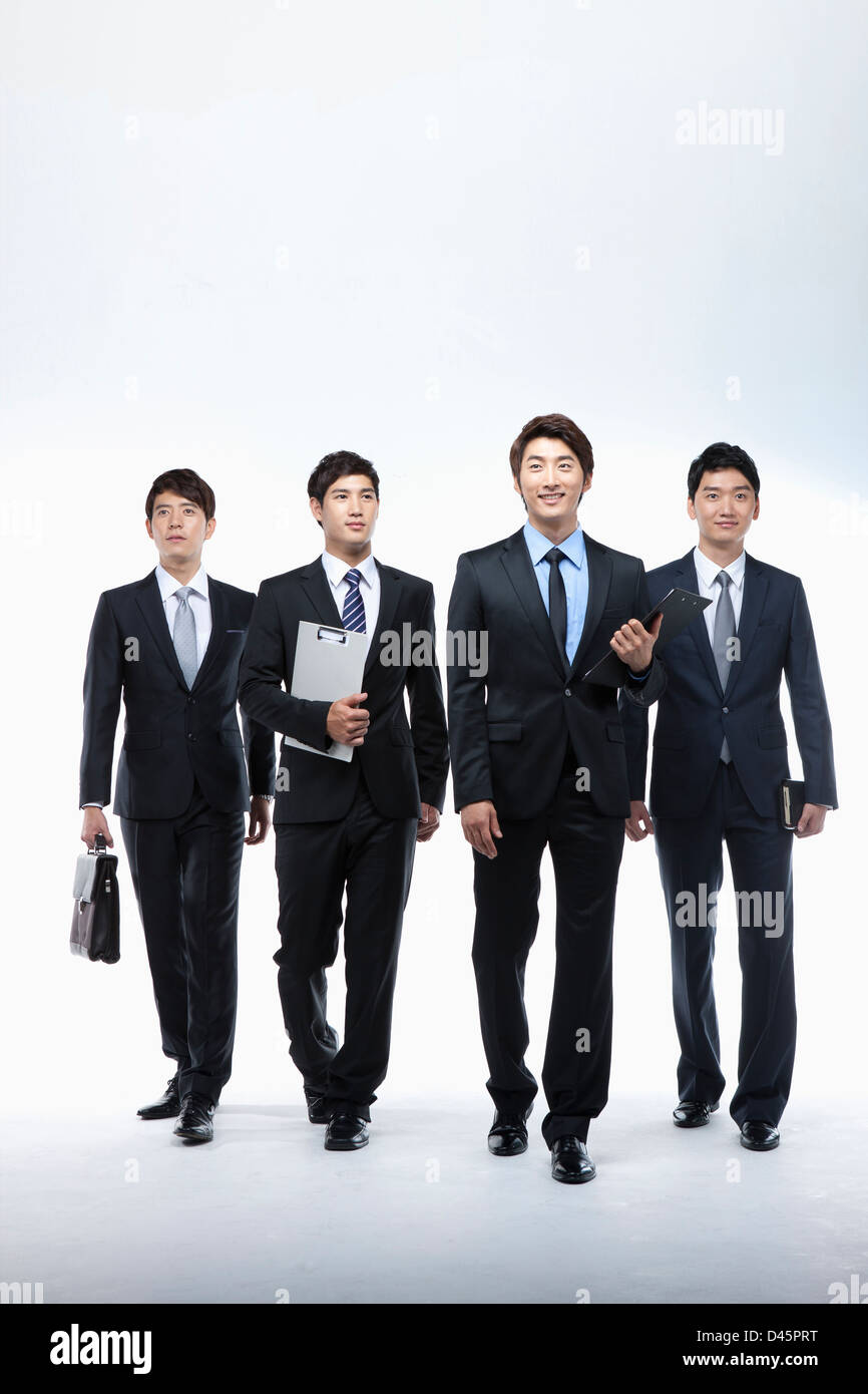full shot of businessmen in business suit walking together Stock Photo ...