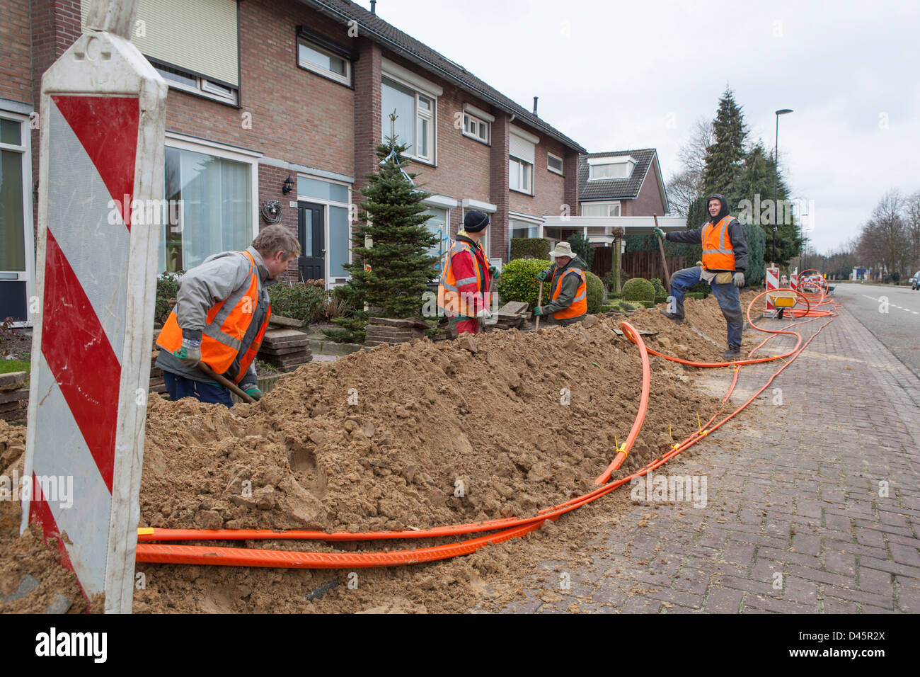 Polish migrant workers do earth work for the construction of a glass fiber infrastructure project in the Netherlands Stock Photo