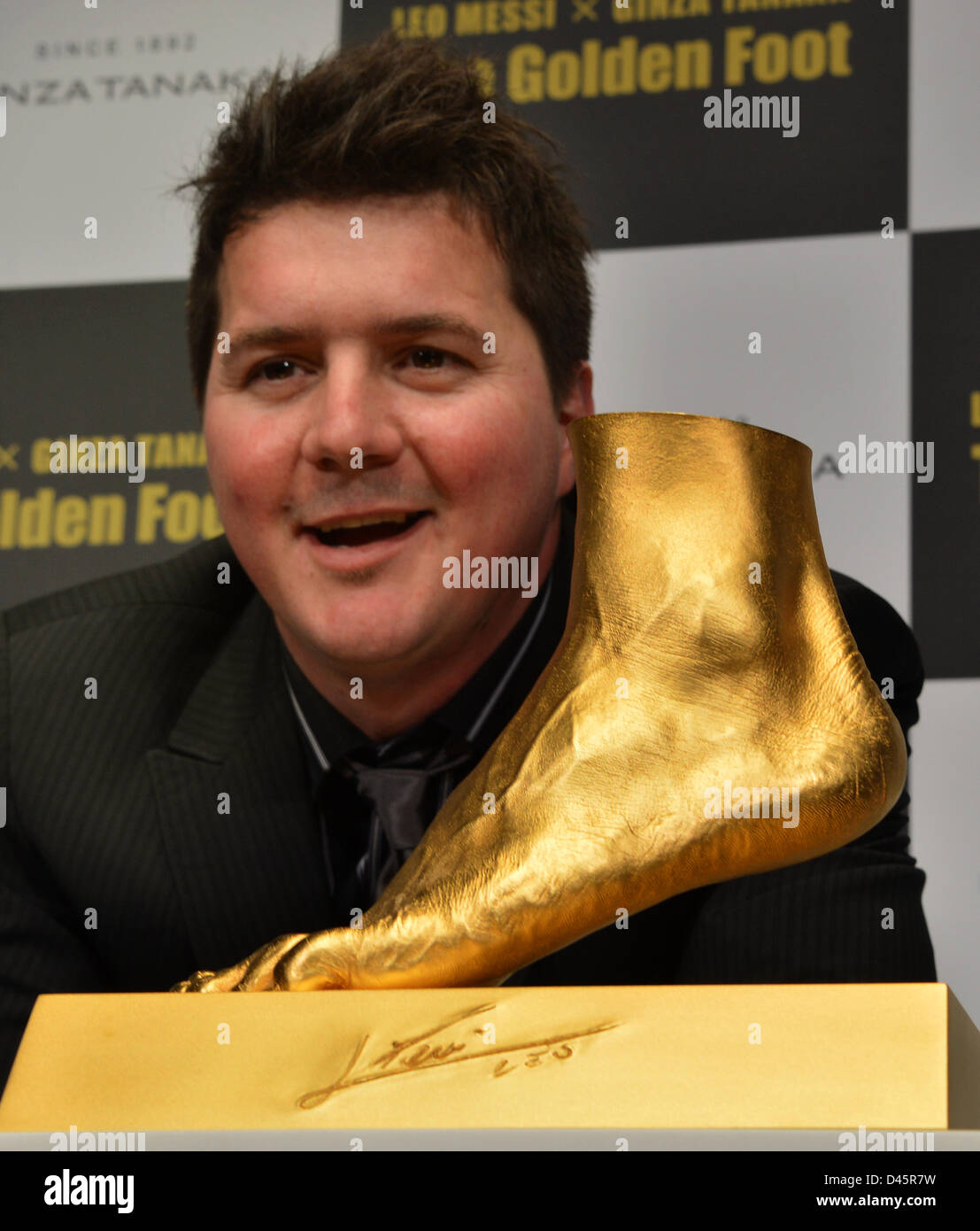 Tokyo, Japan. 6th March, 2013. Rodrigo Messi, elder brother of four-time  FIFA Ballon d'Or winner Lionel Messi of FC Barcelona, poses with "The  Golden Foot" during a sneak preview in Tokyo on
