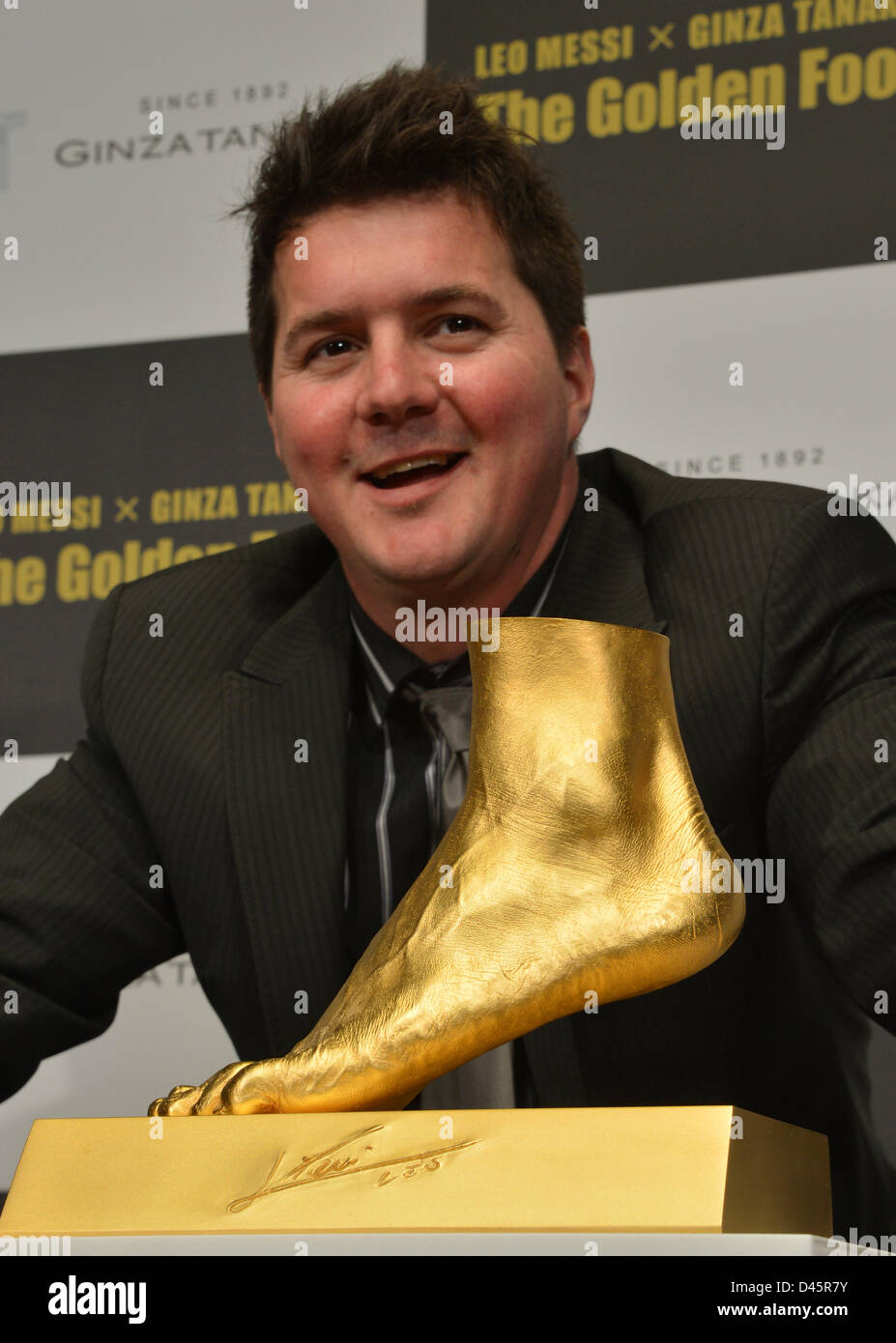 Tokyo, Japan. 6th March, 2013. Rodrigo Messi, elder brother of four-time  FIFA Ballon d'Or winner Lionel Messi of FC Barcelona, poses with "The  Golden Foot" during a sneak preview in Tokyo on