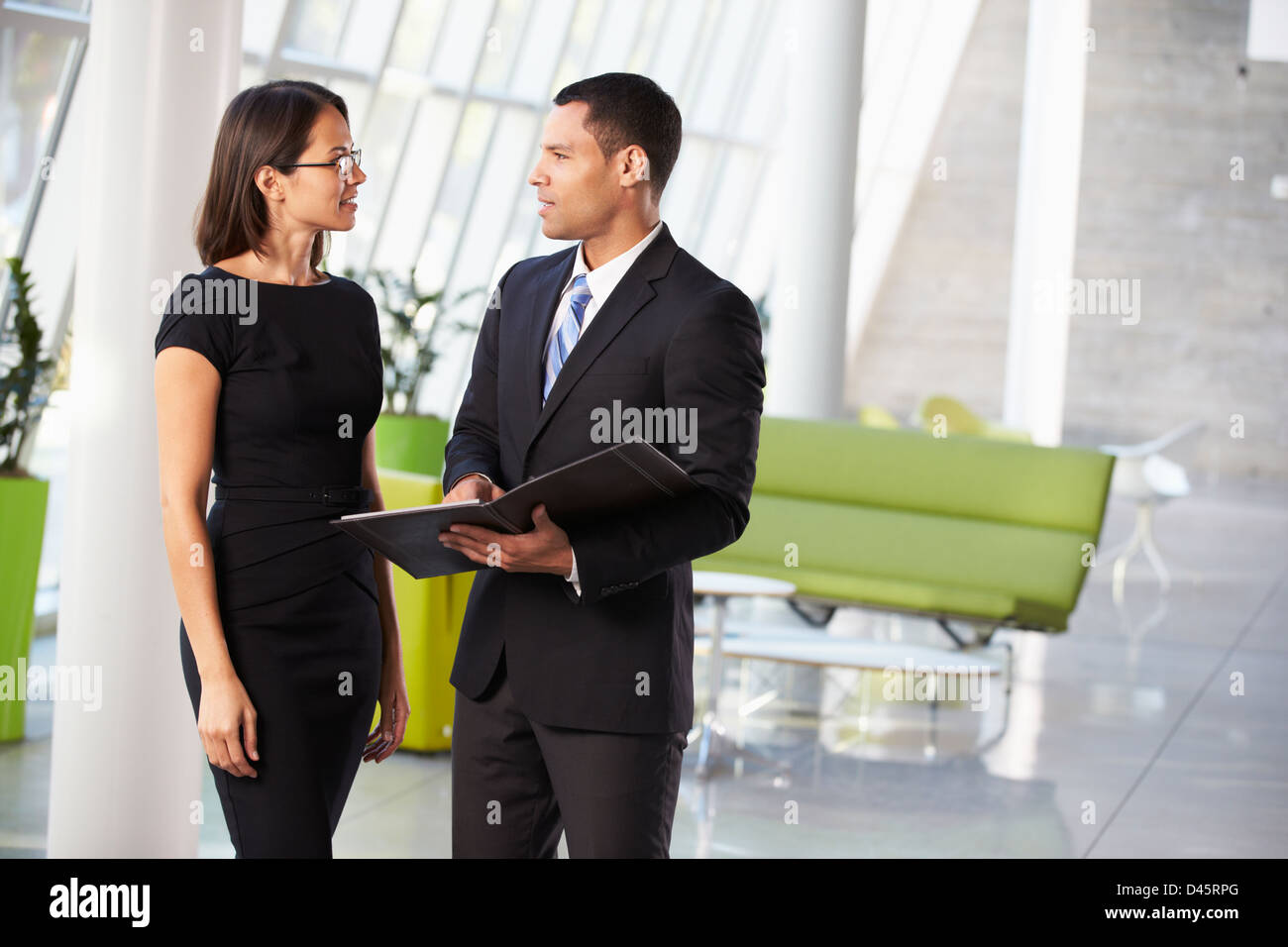 Businessman And Businesswomen Having Informal Meeting In Office Stock ...