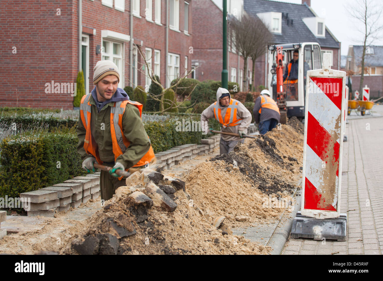 Hungarian migrant workers do earth work for the construction of a glass fiber infrastructure in Netherlands Stock Photo