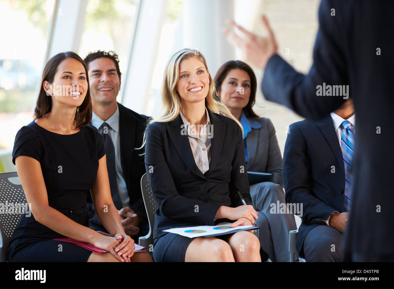 Audience Listening To Presentation At Conference Stock Photo