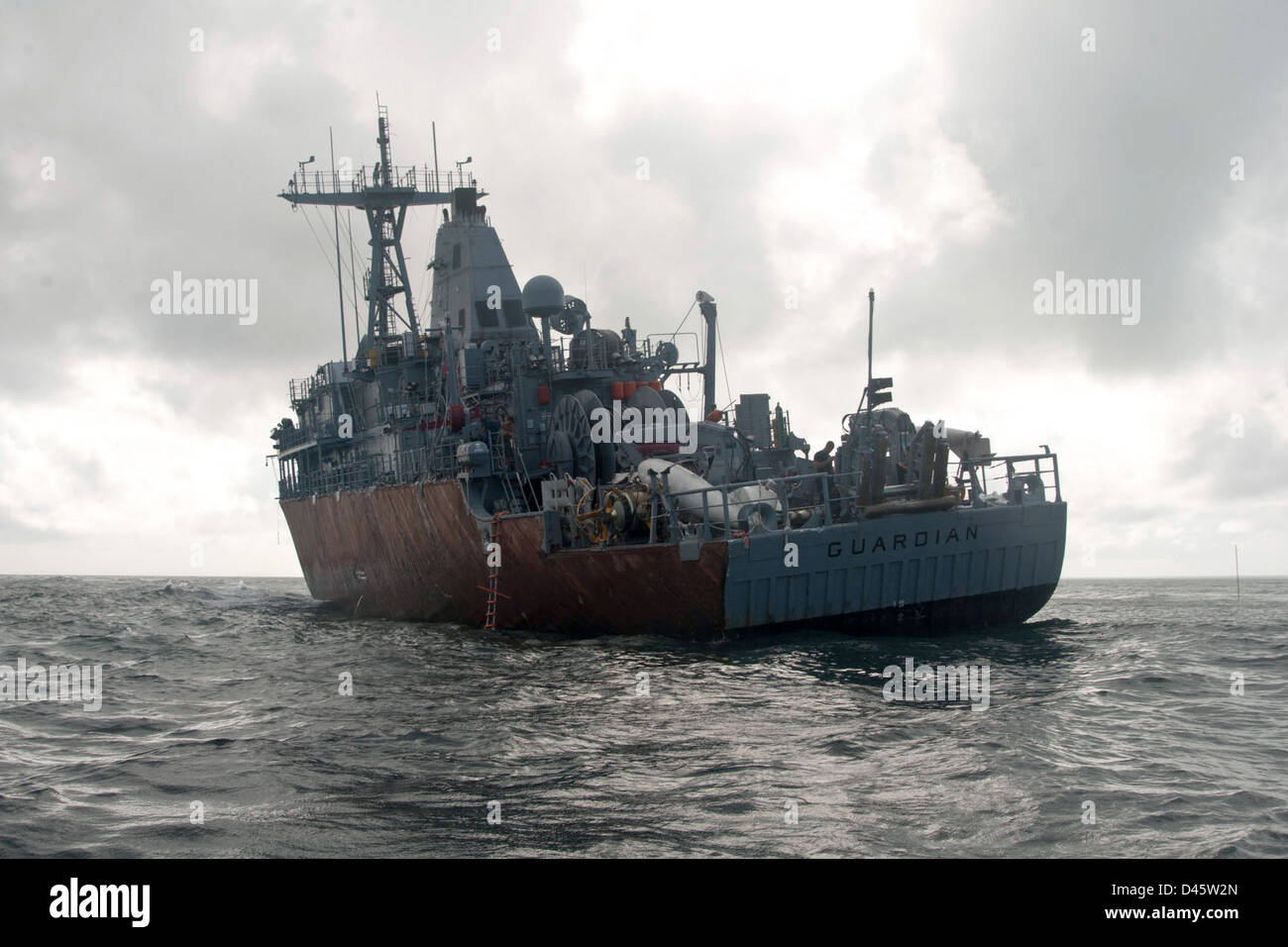 USS Guardian sits aground on Tubbataha Reef. Stock Photo