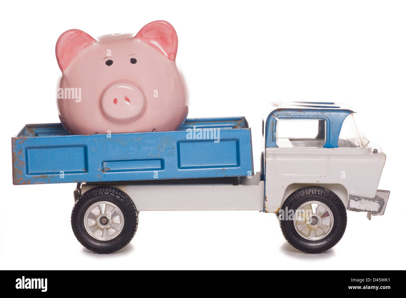 piggy bank in the back of a lorry studio cutout Stock Photo