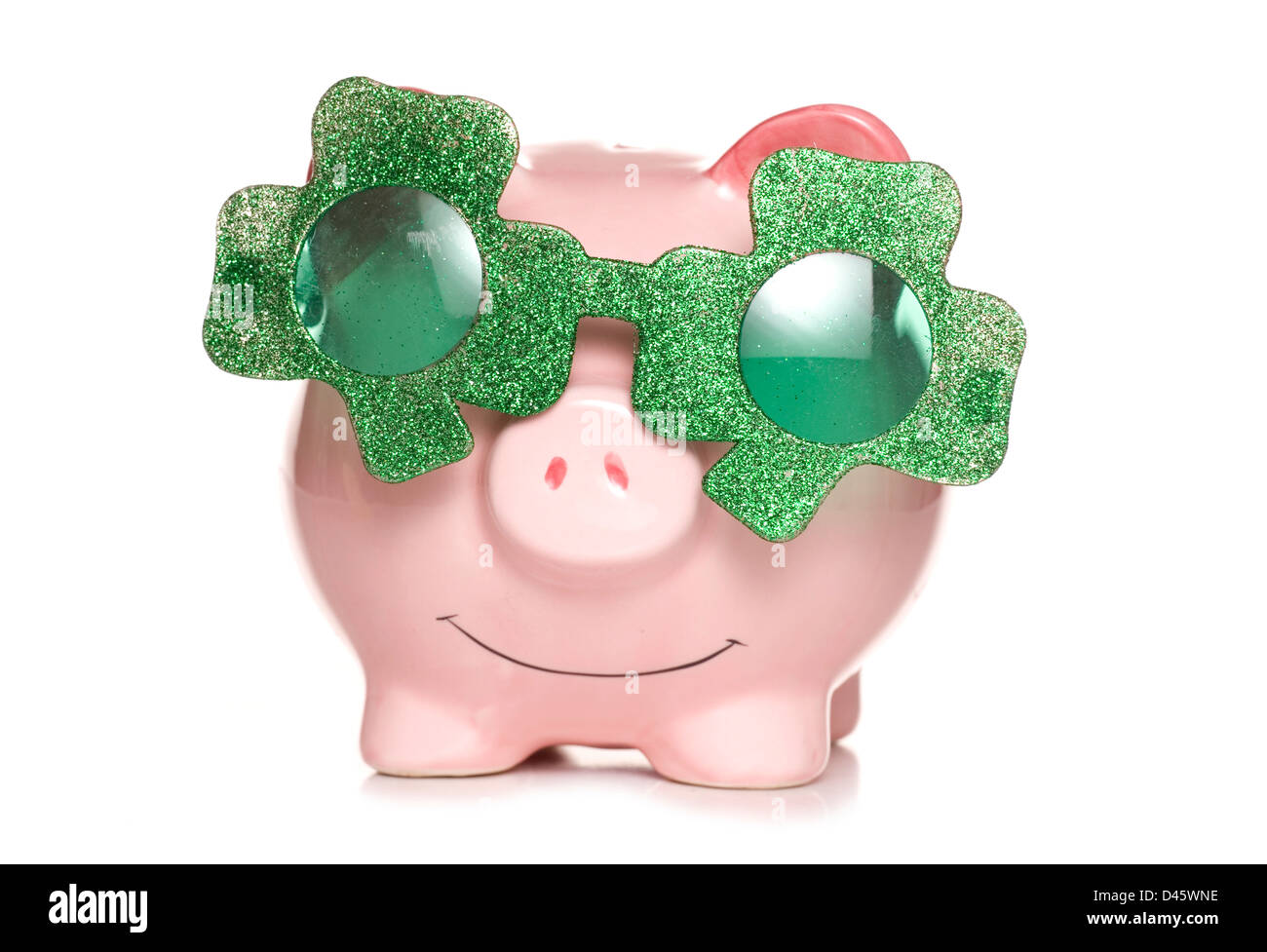 piggy bank wearing irish shamrock sun glasses studio cutout Stock Photo
