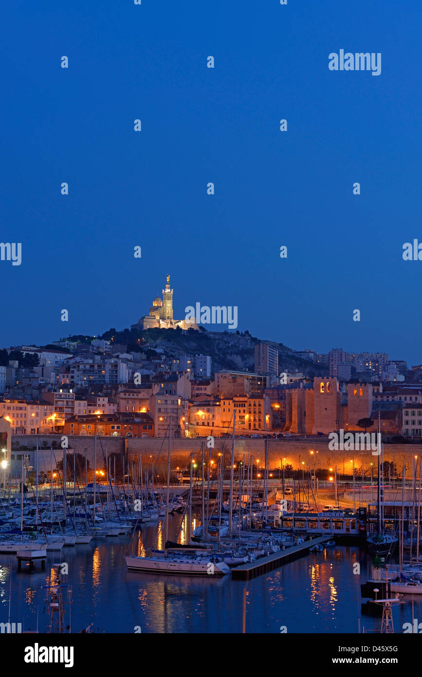 Boats in the marina of the Vieux-Port with Notre Dame de la Garde in ...