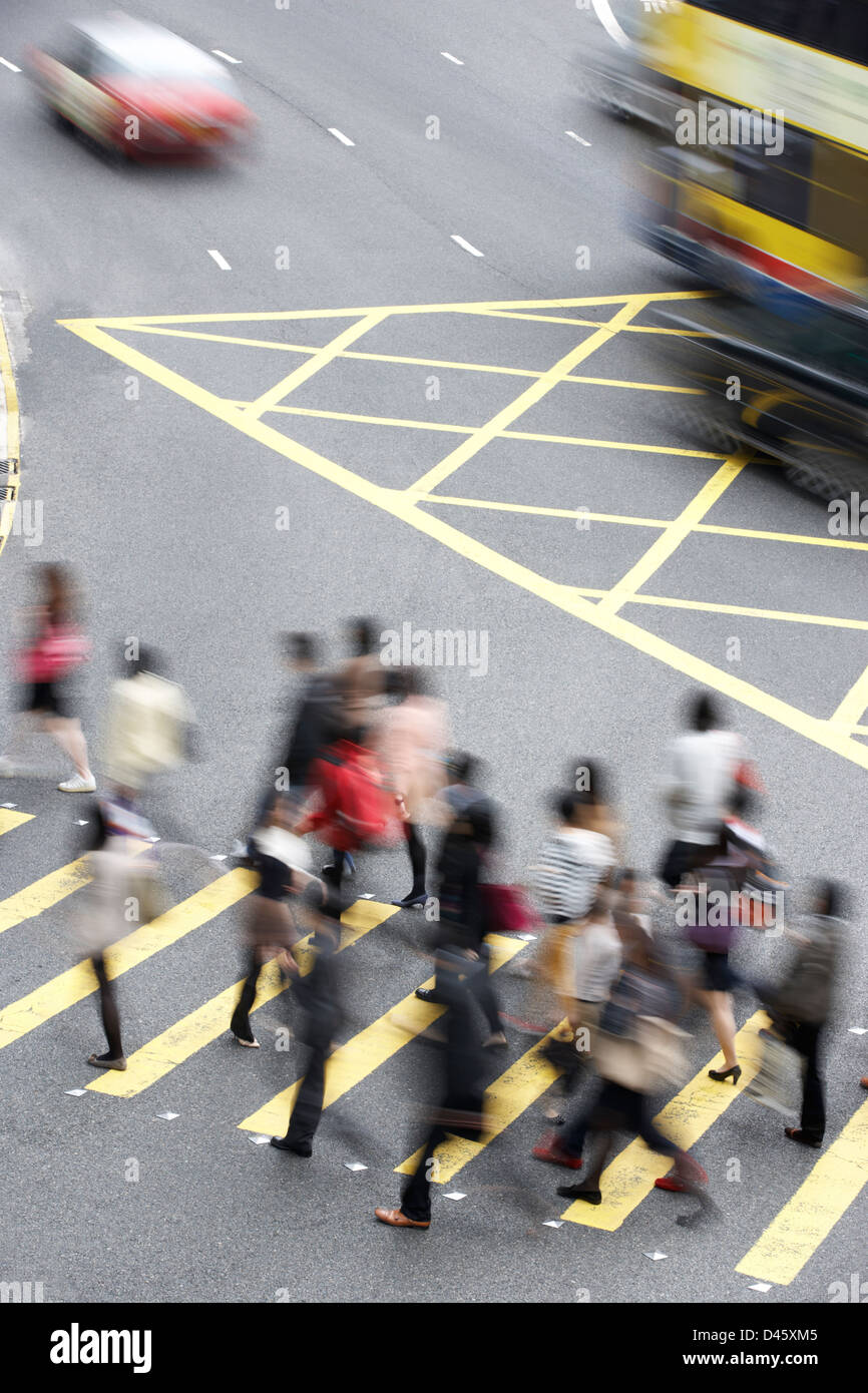 Overhead View Of Commuters Crossing Busy Hong Kong Street Stock Photo