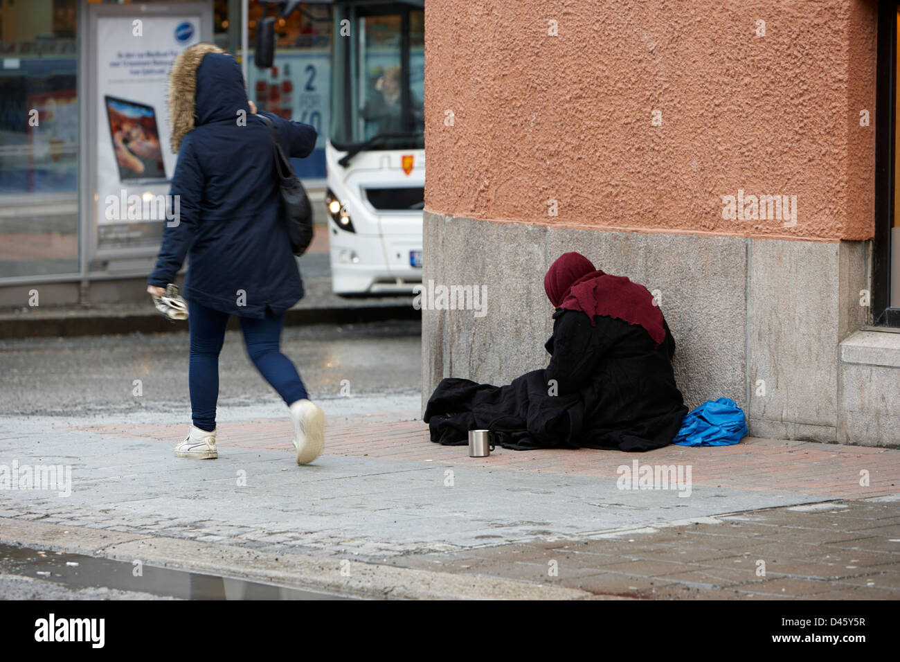 begger on cold winter street Tromso troms Norway europe Stock Photo