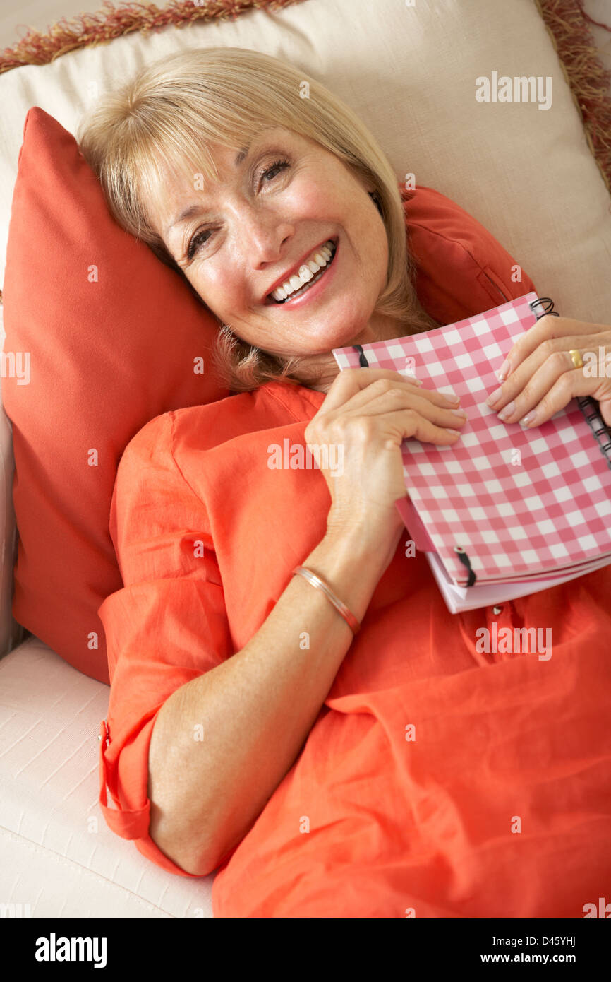 Shocked women sitting on sofa hi-res stock photography and images - Alamy