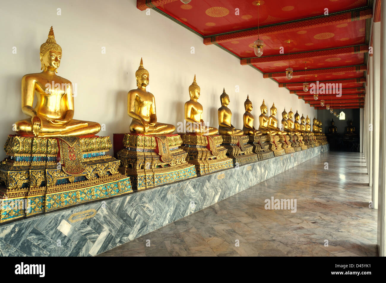 Row of the sacred Buddha image in Wat Sutad temple, Thai Stock Photo ...