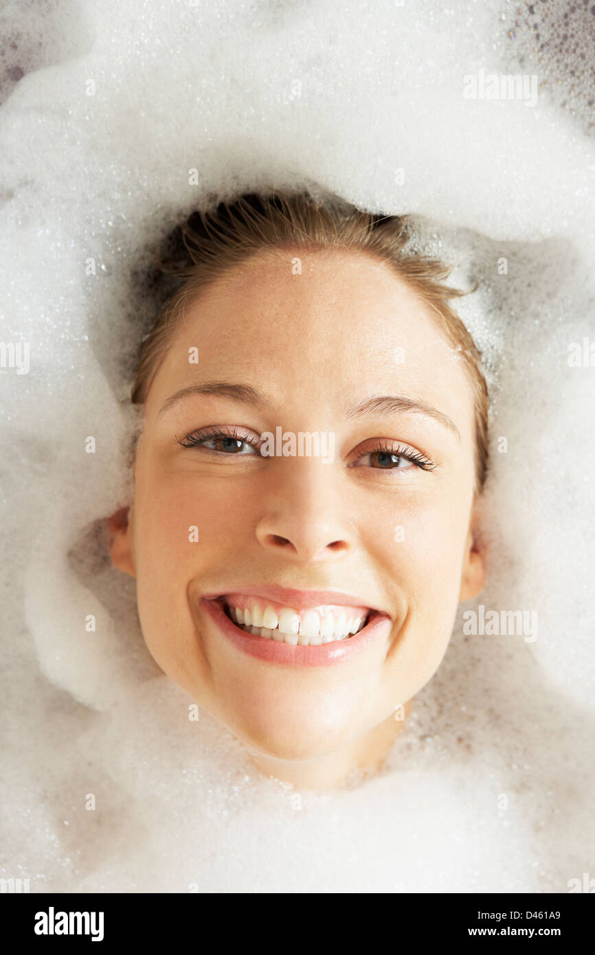 Woman Relaxing In Bubble Filled Bath Stock Photo Alamy