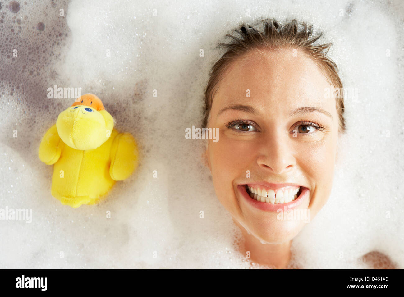 Woman Relaxing In Bubble Filled Bath Stock Photo Alamy