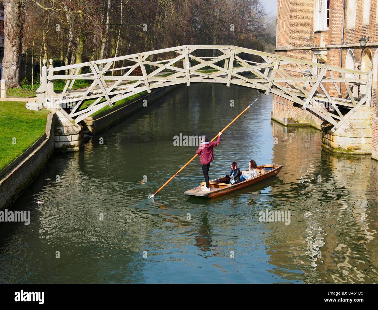 Punt under Mathematical Bridge over River Cam in Cambridge  Stock Photo