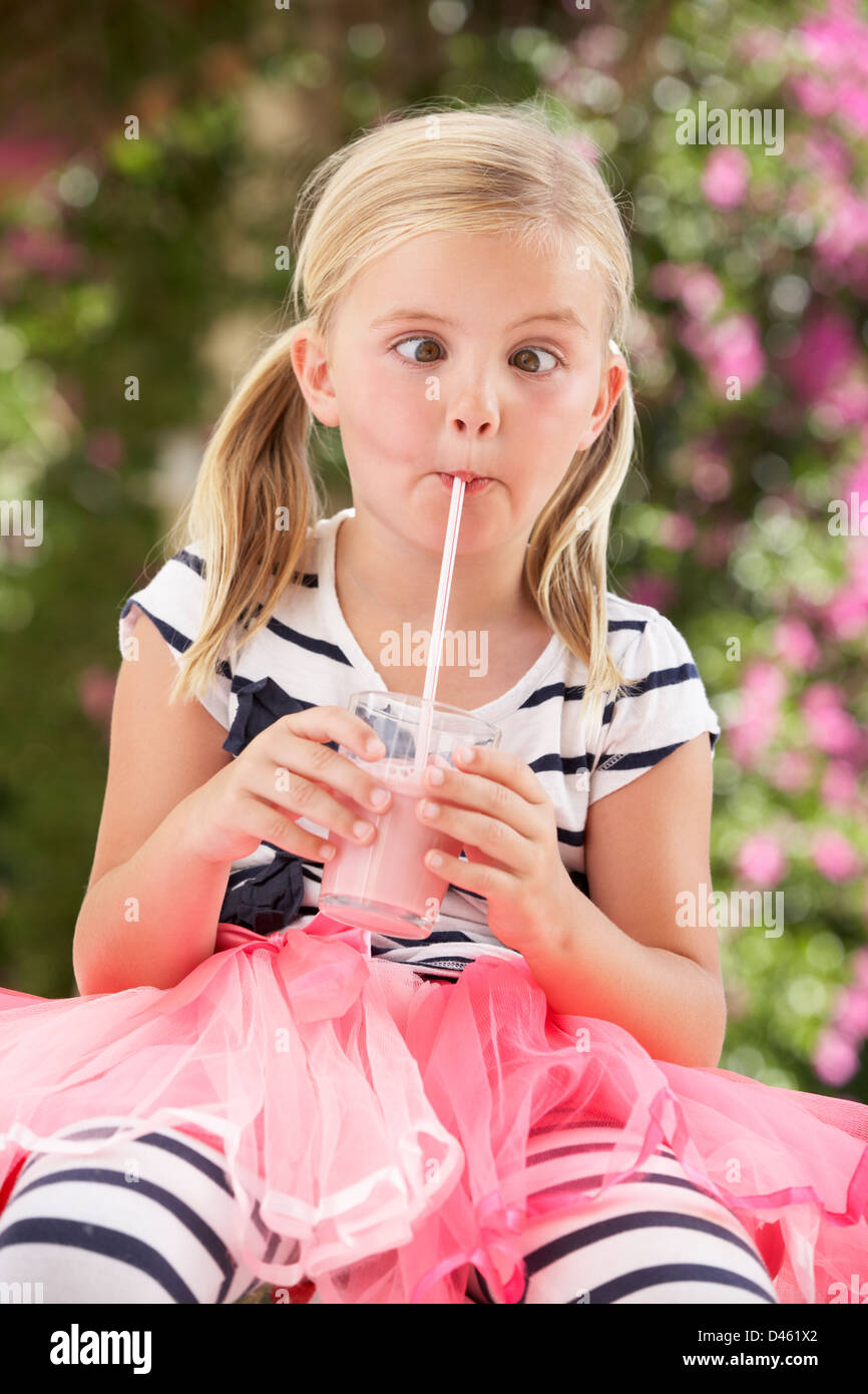 Young Girl Covered In Chocolate Licking Spoon Stock Photo