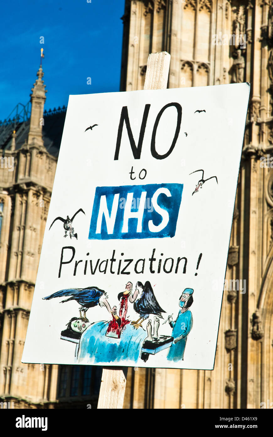 "No to NHS Privatization" poster with facade of Parliament behind, with vultures picking at body of patient. Stock Photo