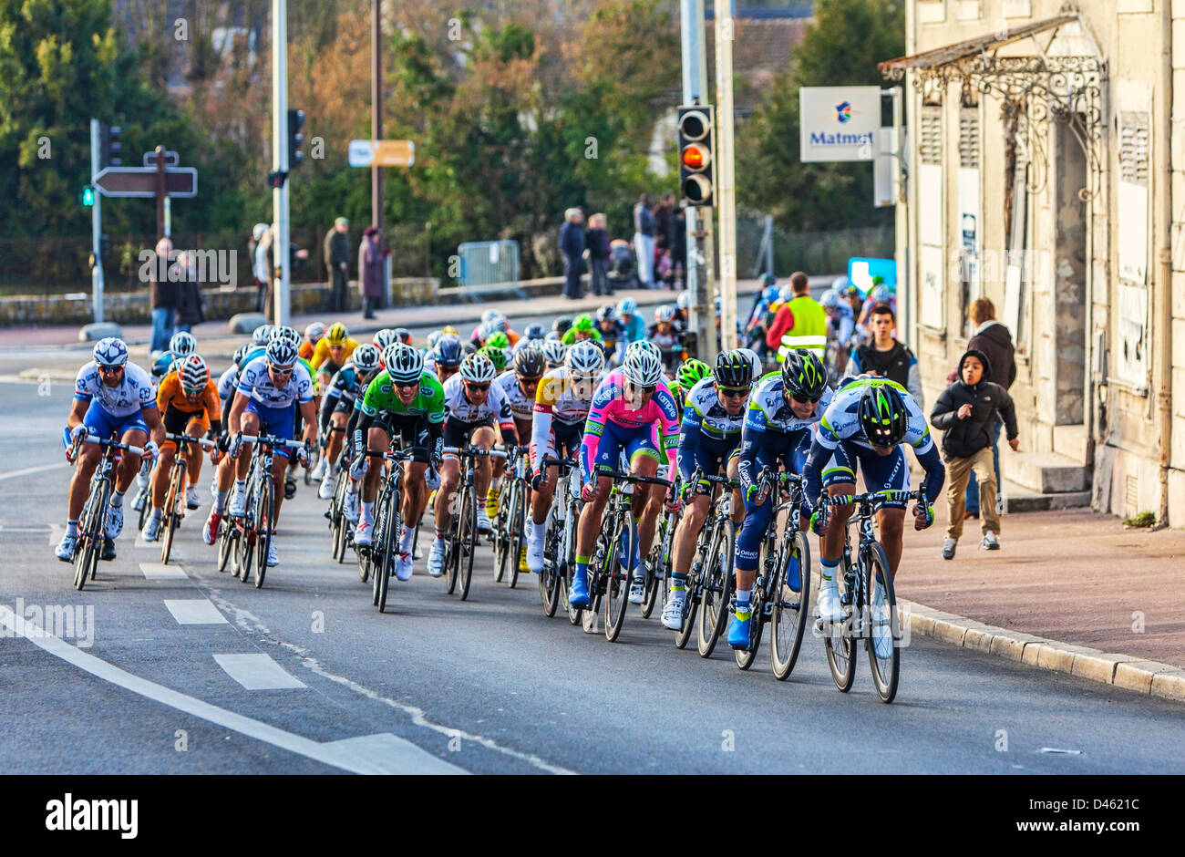 Image of the peloton riding, during the first stage of the famous road bicycle race Paris-Nice, on March 4, 2013 in Nemours. Stock Photo