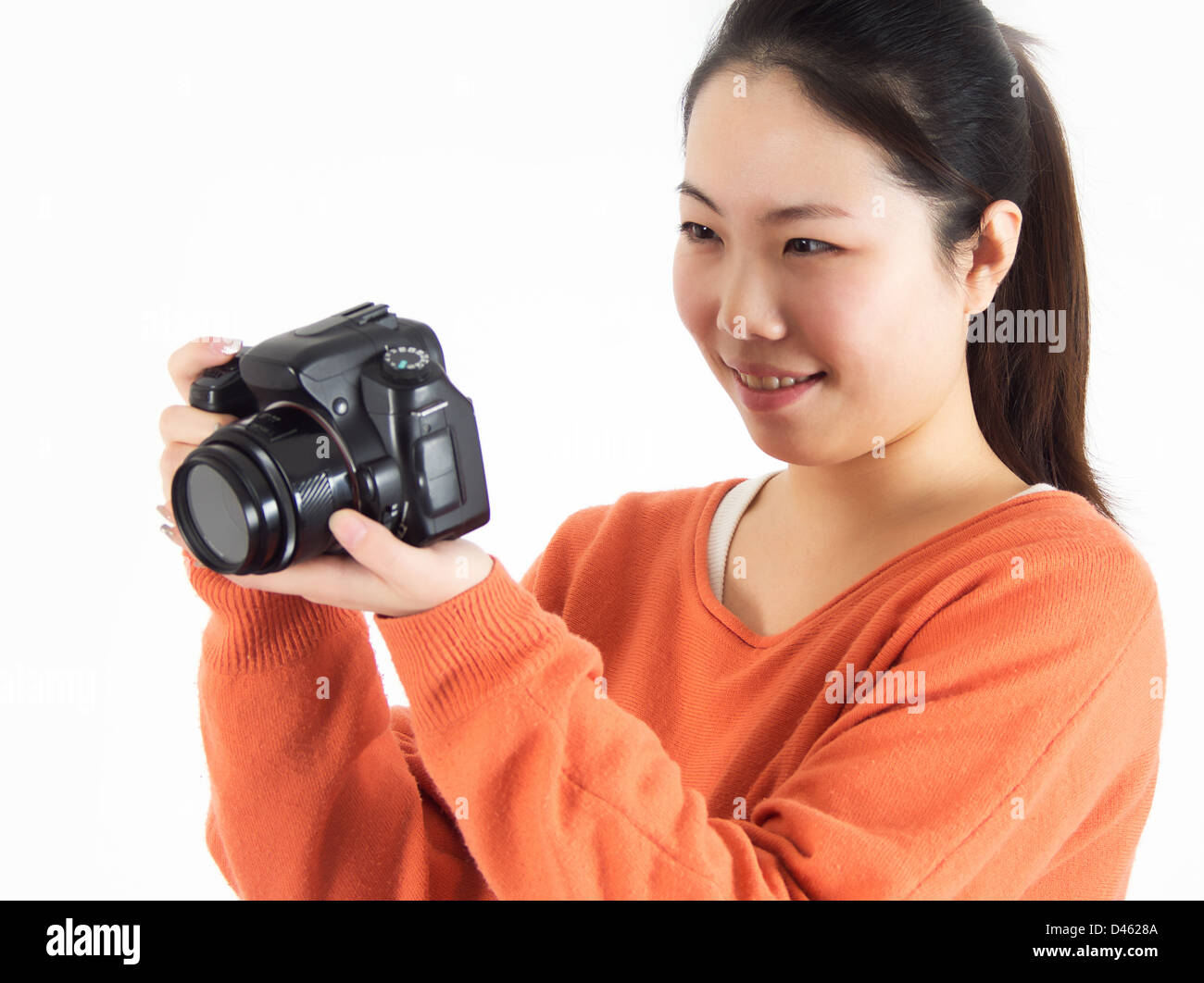 Female photographer in studio using a camera Stock Photo Alamy