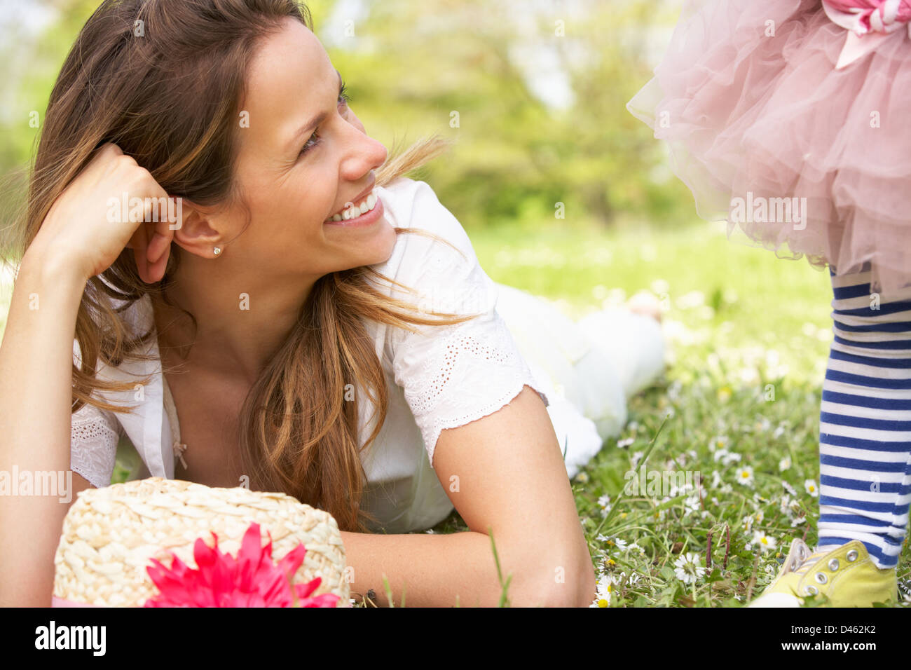 Mother And Daughter In Summer Field Together Stock Photo