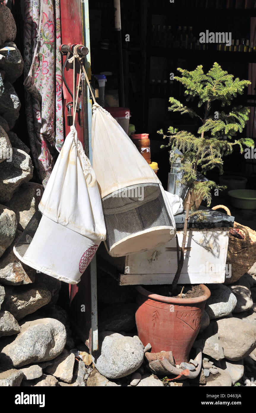 Beekeeping hats outside hanging from shop door in the small village of Setti Fatma, Ourika Valley, Morocco Stock Photo