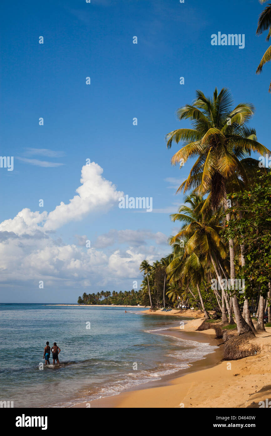 A couple enjoy a secluded beach in Las Terreneas. Stock Photo
