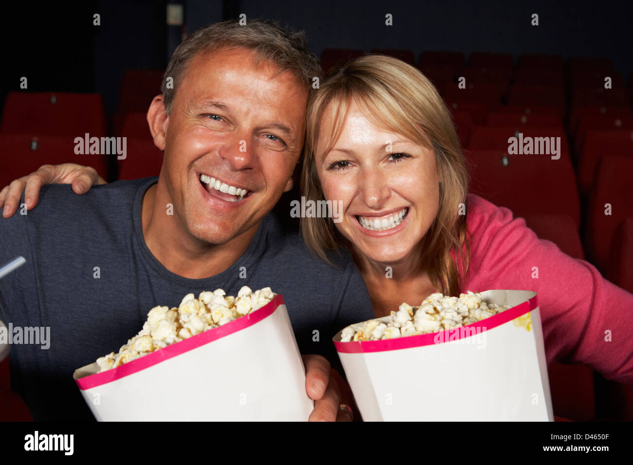 Couple Watching Film In Cinema Stock Photo