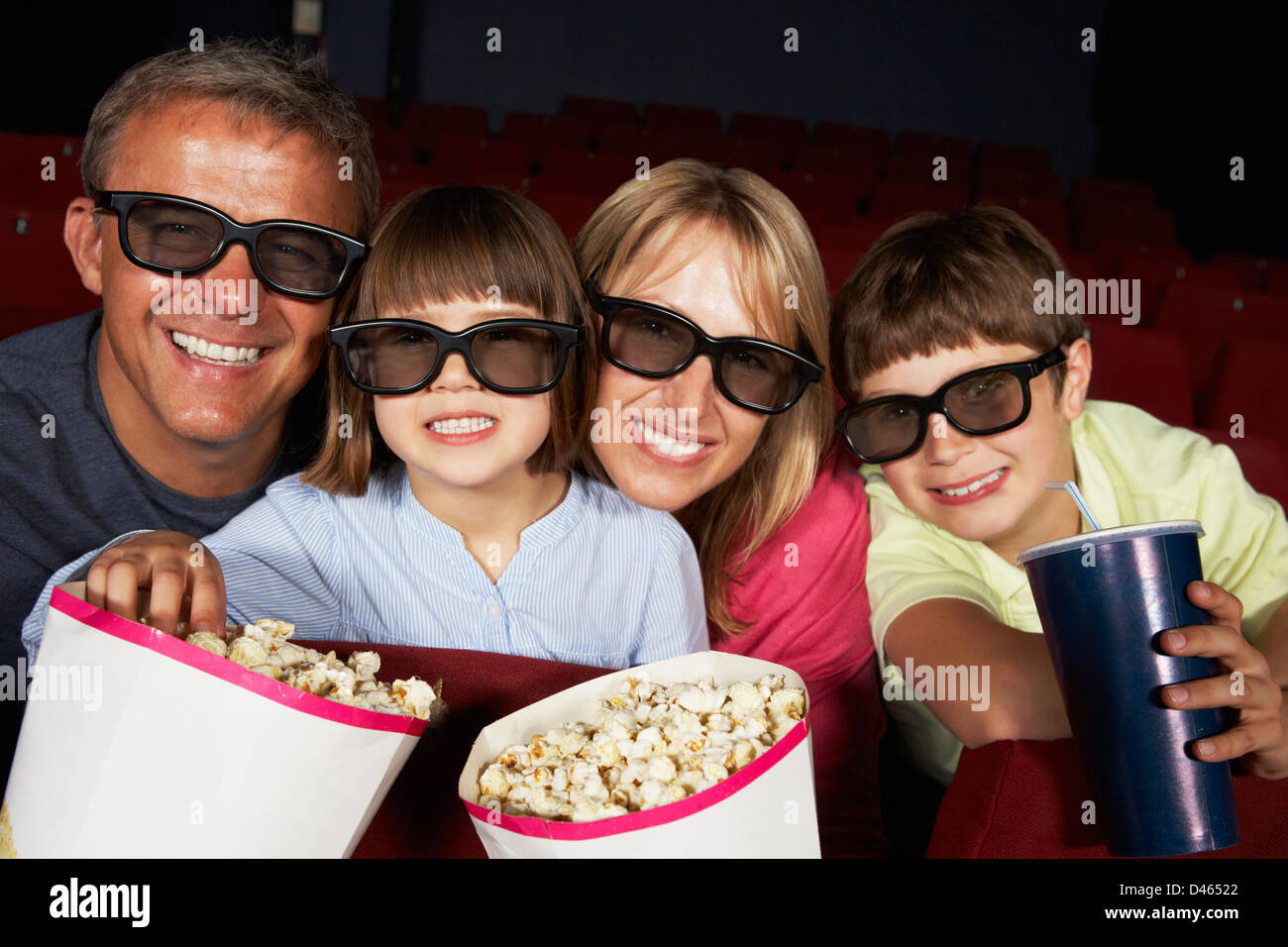 Family Watching 3D Film In Cinema Stock Photo